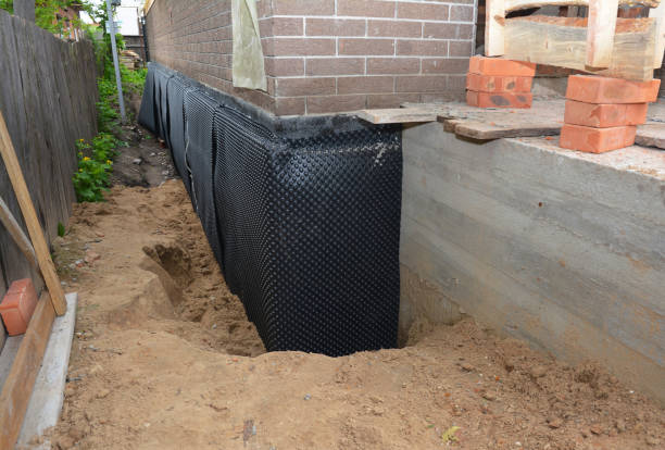 SJ Waterproofing Pros technician performing targeted Basement Waterproofing assessment in Fredonia, KS